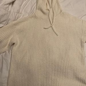 Creamy, soft drawstring sweater